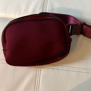 Like new LuLulemon burgundy pouch.